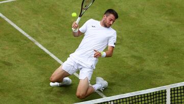 LONDON, ENGLAND - JUNE 13: Pedro Martinez of Spain plays a forehand with partner Diego Schwartzman of Argentina (not in picture) against Rohan Bopanna of India and Denis Shapovalov of Canada during the Men's Doubles First Round match on day one of the cinch Championships at The Queen's Club on June 13, 2022 in London, England. (Photo by Julian Finney/Getty Images)