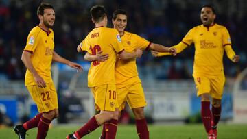 Sevilla's French forward Wissam Ben Yedder (C R) celebrates with teammates after scoring a goal during the Spanish league football match Real Sociedad vs Sevilla FC at the Anoeta stadium in San Sebastian on January 7, 2017. / AFP PHOTO / MIGUEL RIOPA