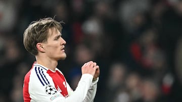 Arsenal's Norwegian midfielder #08 Martin Odegaard celebrates scoring his team's third goal during the UEFA Champions League football match between Arsenal and Dinamo Zagreb at the Emirates Stadium in north London on January 22, 2025. (Photo by JUSTIN TALLIS / AFP)