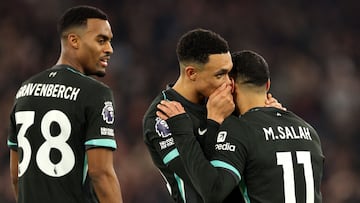 Liverpool's Egyptian striker #11 Mohamed Salah (R) celebrates scoring the team's third goal with Liverpool's English defender #66 Trent Alexander-Arnold (C)  during the English Premier League football match between West Ham United and Liverpool at the London Stadium, in London on December 29, 2024. (Photo by Adrian Dennis / AFP) / RESTRICTED TO EDITORIAL USE. No use with unauthorized audio, video, data, fixture lists, club/league logos or 'live' services. Online in-match use limited to 120 images. An additional 40 images may be used in extra time. No video emulation. Social media in-match use limited to 120 images. An additional 40 images may be used in extra time. No use in betting publications, games or single club/league/player publications. /