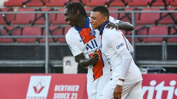 Paris Saint-Germain&#039;s Italian forward Moise Kean (L) celebrates with Paris Saint-Germain&#039;s French forward Kylian Mbappe after scoring a goal during the French L1 football match between Dijon (DFCO) and Paris Saint-Germain (PSG) at the Gaston Ger