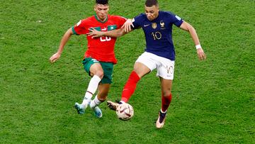 Soccer Football - FIFA World Cup Qatar 2022 - Semi Final - France v Morocco - Al Bayt Stadium, Al Khor, Qatar - December 14, 2022 France's Kylian Mbappe in action with Morocco's Achraf Dari REUTERS/Peter Cziborra