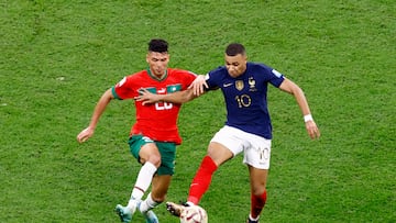 Soccer Football - FIFA World Cup Qatar 2022 - Semi Final - France v Morocco - Al Bayt Stadium, Al Khor, Qatar - December 14, 2022 France's Kylian Mbappe in action with Morocco's Achraf Dari REUTERS/Peter Cziborra