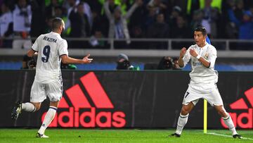 YOKOHAMA, JAPAN - DECEMBER 18: Cristiano Ronaldo of Real Madrid celebrates with Karim Benzema after scoring his sides third goal during the FIFA Club World Cup Final match between Real Madrid and Kashima Antlers at International Stadium Yokohama on Decem