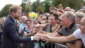 WINDSOR, ENGLAND - SEPTEMBER 10: Prince Harry, Duke of Sussex shakes hands with members of the public on the Long walk at Windsor Castle on September 10, 2022 in Windsor, England. Crowds have gathered and tributes left at the gates of Windsor Castle to Queen Elizabeth II, who died at Balmoral Castle on 8 September, 2022. (Photo by Chris Jackson - WPA Pool/Getty Images)