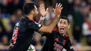 Benfica's Greek forward #14 Vangelis Pavlidis celebrates with Benfica's Argentine forward #11 Angel Di Maria (R) after scoring his team's first goal during the UEFA Champions League, league phase day 5, football match between AS Monaco and SL Benfica at the Stade Louis-II in Monaco, on November 27, 2024. (Photo by Valery HACHE / AFP)