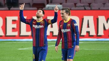 Barcelona's Argentinian forward Lionel Messi (L) celebrates with Barcelona's French midfielder Antoine Griezmann after scoring a goal during the Spanish league football match between FC Barcelona and Deportivo Alaves at the Camp Nou stadium in B
