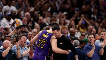 DALLAS, TEXAS - APRIL 09: (L-R) Luka Doncic #77 hugs head coach JJ Redick of the Los Angeles Lakers against the Dallas Mavericks during the fourth quarter at American Airlines Center on April 09, 2025 in Dallas, Texas. NOTE TO USER: User expressly acknowledges and agrees that, by downloading and or using this photograph, user is consenting to the terms and conditions of the Getty Images License Agreement. Sam Hodde/Getty Images/AFP (Photo by Sam Hodde / GETTY IMAGES NORTH AMERICA / Getty Images via AFP)