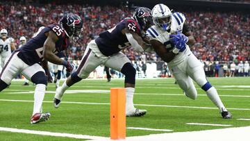 Jan 5, 2019; Houston, TX, USA; Indianapolis Colts running back Marlon Mack (25) is pushed out of bounds by Houston Texans strong safety Kareem Jackson (25) and inside linebacker Benardrick McKinney (55) in the first quarter in a AFC Wild Card playoff foot