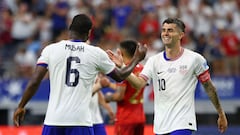 USA's midfielder #06 Yunus Musah and USA's forward #10 Christian Pulisic greet each other after their victory in the Conmebol 2024 Copa America tournament group C football match between the USA and Bolivia at AT&T Stadium in Arlington