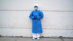 FILE PHOTO: Hellen Nanez, who lost 13 relatives to the coronavirus disease (COVID-19) and whose father is being treated for COVID-19 in the Intensive Care Unit, poses for a photograph after seeing her father through a window at the hospital, in Pisco, Peru, May 11, 2021. REUTERS/Alessandro Cinque/File Photo