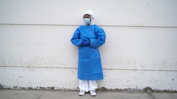 FILE PHOTO: Hellen Nanez, who lost 13 relatives to the coronavirus disease (COVID-19) and whose father is being treated for COVID-19 in the Intensive Care Unit, poses for a photograph after seeing her father through a window at the hospital, in Pisco, Peru, May 11, 2021. REUTERS/Alessandro Cinque/File Photo