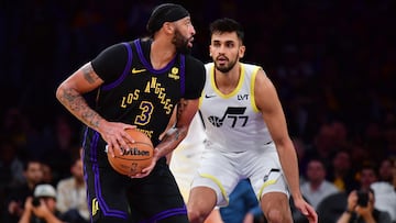 Nov 21, 2023; Los Angeles, California, USA; Los Angeles Lakers forward Anthony Davis (3) moves the ball against Utah Jazz center Omer Yurtseven (77) during the second half at Crypto.com Arena. Mandatory Credit: Gary A. Vasquez-USA TODAY Sports