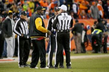 DENVER, CO - JANUARY 17: Head coach Mike Tomlin of the Pittsburgh Steelers argues a call with the referees against the Denver Broncos during the AFC Divisional Playoff Game at Sports Authority Field at Mile High on January 17, 2016 in Denver, Colorado.   