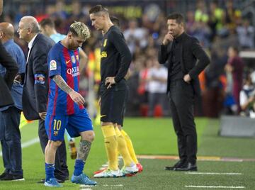 Leo Messi limped off after an hour following a tussle with Diego Godín