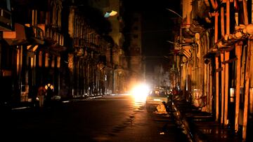 People walk in the street at night as Cuba is hit by an island-wide blackout, in Havana, Cuba, October 18, 2024. REUTERS/Norlys Perez