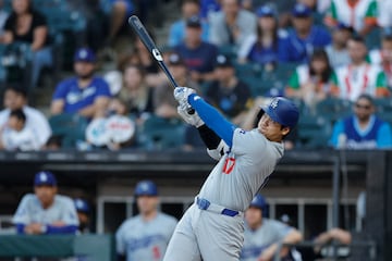 Los Angeles Dodgers designated hitter Shohei Ohtani (17) hits a solo home run against the Chicago White Sox.