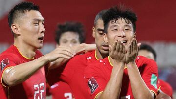 China&#039;s forward Wu Lei (R) celebrates after scoring during the 2022 Qatar World Cup Asian Qualifiers football match between China and Vietnam, at the Sharjah Football Stadium in the Emirati city, on October 7, 2021. (Photo by Karim SAHIB / AFP)