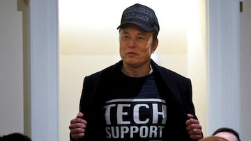 FILE PHOTO: Elon Musk shows off his t-shirt reading "Tech Support" while speaking at the first cabinet meeting hosted by U.S. President Donald Trump, at the White House in Washington, DC, U.S., February 26, 2025. REUTERS/Brian Snyder/File Photo