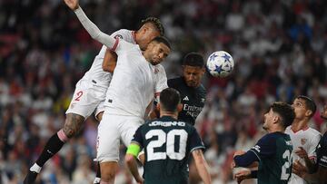 Sevilla's Dominican forward #12 Mariano Diaz (L) and Sevilla's Moroccan forward #15 Youssef En-Nesyri vie for a header with Arsenal's French defender #02 William Saliba during the UEFA Champions League 1st round day 3 Group B football match between Sevilla FC and Arsenal at the Ramon Sanchez Pizjuan stadium in Seville on October 24, 2023. (Photo by JORGE GUERRERO / AFP)