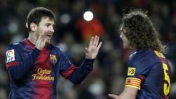 Messi y Puyol.