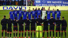 Players from both sides and supporters observe a moment of reflection to honour Cardiff&#039;s Argentinian striker Emiliano Sala, whose flight disappeared from radar over the English Channel north of Guernsey, before the English Premier League football ma