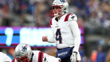 EAST RUTHERFORD, NEW JERSEY - NOVEMBER 26: Bailey Zappe #4 of the New England Patriots calls a play during the third quarter against the New York Giants at MetLife Stadium on November 26, 2023 in East Rutherford, New Jersey.   Elsa/Getty Images/AFP (Photo by ELSA / GETTY IMAGES NORTH AMERICA / Getty Images via AFP)