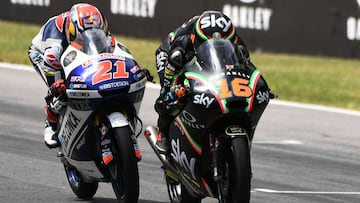 Sky Racing Team VR46 rider Italian Andrea Migno (R) competes with Del Conca Gresini rider, Italian Fabio Di Giannantonio during the Moto3 Grand Prix at the Mugello race track on June 4, 2017.
Sky Racing Team VR46 rider Italian Andrea Migno won the race ahead of Del Conca Gresini rider, Italian Fabio Di Giannantonio and RBA BOE Racing Team rider, Spanish Juanfran Guevara. / AFP PHOTO / Vincenzo PINTO