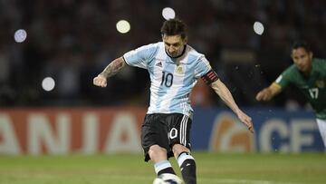 Argentina's Lionel Messi takes a penalty to score against Bolivia during the Russia 2018 FIFA World Cup South American Qualifiers' football match in Cordoba, Argentina, on March 29, 2016. AFP PHOTO / JUAN MABROMATA