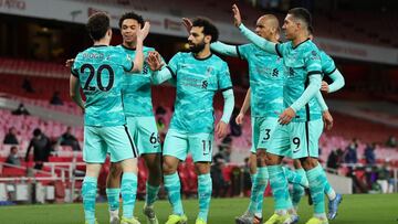 LONDON, ENGLAND - APRIL 03: Diogo Jota of Liverpool celebrates with Trent Alexander-Arnold, Mohamed Salah and teammates after scoring their team's first goal during the Premier League match between Arsenal and Liverpool at Emirates Stadium on April 0