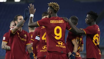 Roma's Tammy Abraham, center, celebrates with teammates after scoring during the Italian Cup soccer match between Roma and Lecce at Rome's Olympic stadium, Thursday, Jan. 20, 2022. (AP Photo/Alessandra Tarantino)