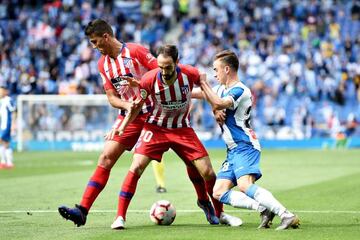 Adria Pedrosa of Espanyol battles for the ball with Atlético's Rodrigo Hernandez Cascante and Juanfran.