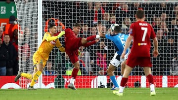 LIVERPOOL, ENGLAND - NOVEMBER 27: Roberto Firmino of Liverpool shoots which is then cleared off the line by Kalidou Koulibaly of Napoli (not pictured) during the UEFA Champions League group E match between Liverpool FC and SSC Napoli at Anfield on Novembe
