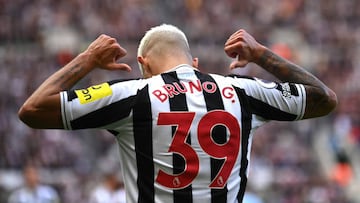 NEWCASTLE UPON TYNE, ENGLAND - OCTOBER 08: Newcastle player Bruno Guimaraes celebrates his second goal by pointing to his name during the Premier League match between Newcastle United and Brentford FC at St. James Park on October 08, 2022 in Newcastle upon Tyne, England. (Photo by Stu Forster/Getty Images)