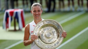 Tennis - Wimbledon - All England Lawn Tennis and Croquet Club, London, Britain - July 14, 2018 's Angelique Kerber celebrates winning the women's singles final with the trophy REUTERS/Andrew Boyers