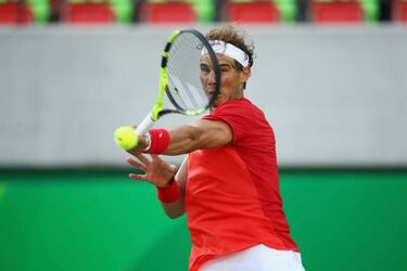 Muguruza crashes out of Rio; Nadal breezes through