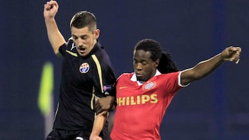 Dinamo Zagreb's Arijan Adomi (7) challenges PSV Eindhoven's Florian Jozefzoon during their Europa League match at Maksimir stadium in Zagreb October 24, 2013.REUTERS/Antonio Bronic (CROATIA - Tags: SPORT SOCCER)