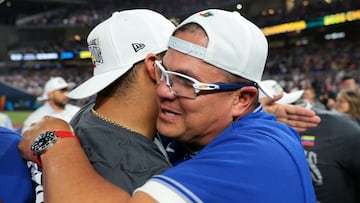 Mar 17, 2026; Miami, FL, United States; Venezuela manager Omar Lopez (22) reacts after defeating the United States during the 2026 World Baseball Classic Championship game at loanDepot Park. Mandatory Credit: Sam Navarro-Imagn Images