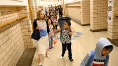 DENVER, COLORADO - AUGUST 22: Denver Public School students at Ellis Elementary School follow their 1st grade teacher Megan Westmore to her classroom for the  return of the 2022-23 school year on August 22, 2022 in Denver, Colorado. (Photo by RJ Sangosti/MediaNews Group/The Denver Post via Getty Images)