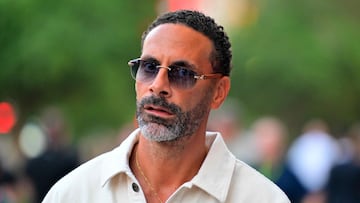 Former English footballer Rio Ferdinand walks in the paddock ahead of the Formula One Qatar Grand Prix at the Lusail International Circuit in Lusail on November 30, 2025. (Photo by Andrej ISAKOVIC / AFP)
