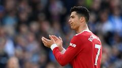 Manchester United's Portuguese striker Cristiano Ronaldo applauds supporters on the pitch after the English Premier League football match between Brighton and Hove Albion and Manchester United at the American Express Community Stadium in Brighton, southern England on May 7, 2022. - Brighton won the game 4-0. (Photo by Glyn KIRK / AFP) / RESTRICTED TO EDITORIAL USE. No use with unauthorized audio, video, data, fixture lists, club/league logos or 'live' services. Online in-match use limited to 120 images. An additional 40 images may be used in extra time. No video emulation. Social media in-match use limited to 120 images. An additional 40 images may be used in extra time. No use in betting publications, games or single club/league/player publications. / 