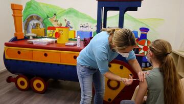 A girl gets a dose of the Pfizer-BioNTech children vaccine against the coronavirus disease (COVID-19)