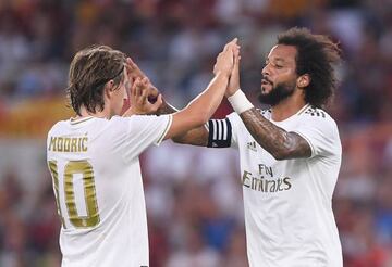 Marcelo celebrates scoring Madrid's first goal against Roma with Luka Modric.