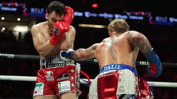 USA's Jake Paul (R) and Mexico's Julio Cesar Chavez Jr. fight during their cruiserweight boxing bout at the Honda Center in Anaheim, California, on June 28, 2025. (Photo by Patrick T. Fallon / AFP)