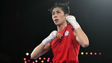 Taiwan's Lin Yu-ting reacts after beating Poland's Julia Szeremeta (Blue) in the women's 57kg final boxing match during the Paris 2024 Olympic Games at the Roland-Garros Stadium, in Paris on August 10, 2024. (Photo by Mauro PIMENTEL / AFP)