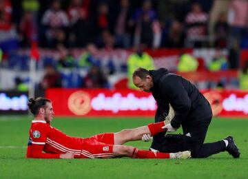 Gareth Bale receives treatment from medical staff