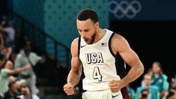 USA's #04 Stephen Curry celebrates after scoring in the men's semifinal basketball match between USA and Serbia during the Paris 2024 Olympic Games at the Bercy Arena in Paris on August 8, 2024. (Photo by Aris MESSINIS / AFP)