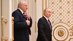 Russian President Vladimir Putin and Belarusian President Alexander Lukashenko arrive for a news conference following their meeting in Minsk, Belarus December 19, 2022. Sputnik/Pavel Bednyakov/Kremlin via REUTERS ATTENTION EDITORS - THIS IMAGE WAS PROVIDED BY A THIRD PARTY.