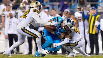 CHARLOTTE, NC - NOVEMBER 17: Greg Olsen #88 of the Carolina Panthers runs the ball against Kenny Vaccaro #32 and Vonn Bell #48 of the New Orleans Saints in the 3rd quarter during the game at Bank of America Stadium on November 17, 2016 in Charlotte, North Carolina. Grant Halverson/Getty Images/AFP
== FOR NEWSPAPERS, INTERNET, TELCOS & TELEVISION USE ONLY ==