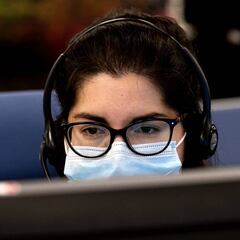 How can I talk to a real person when phoning the IRS helpline?